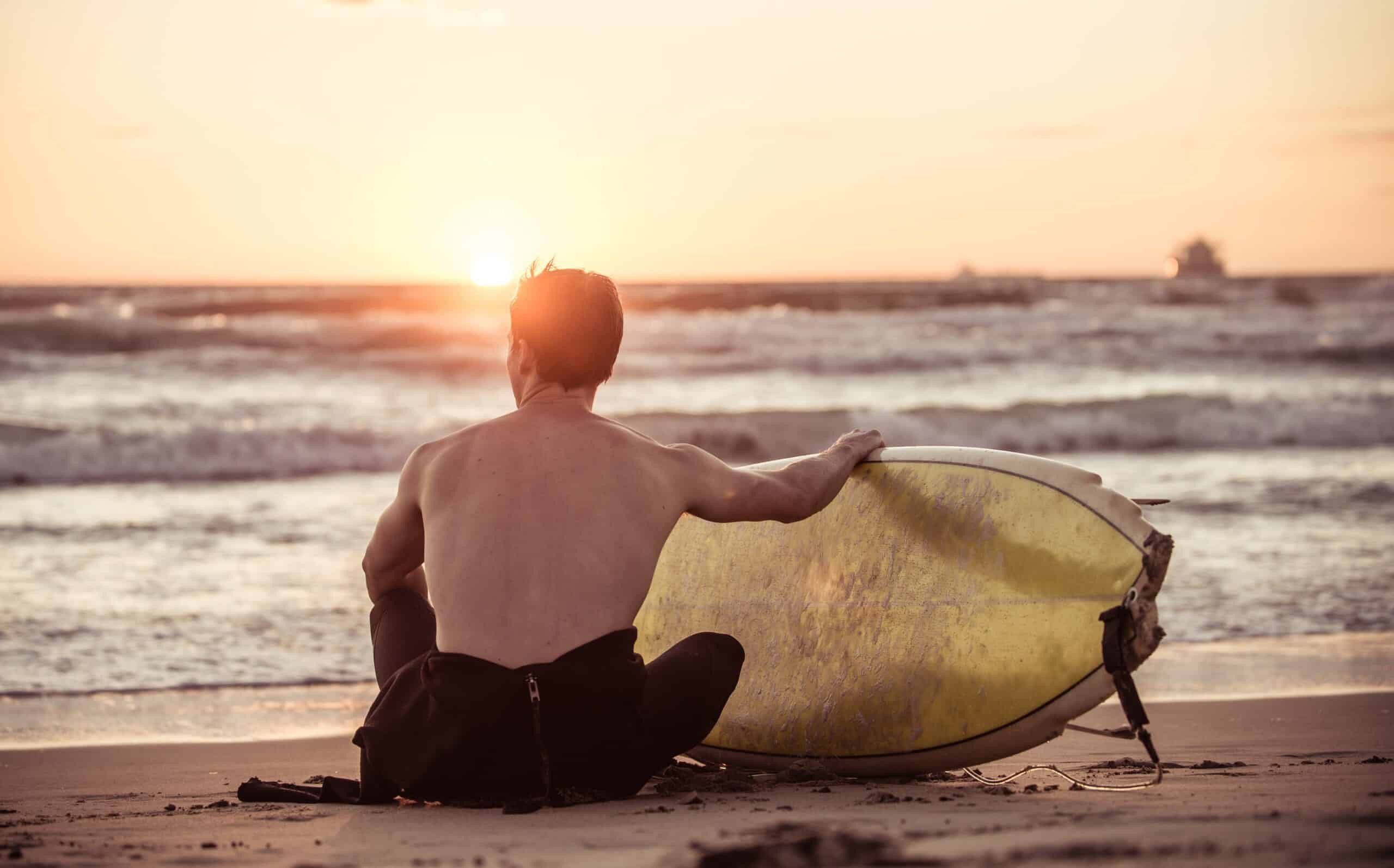 Surfer taking a break on the beach